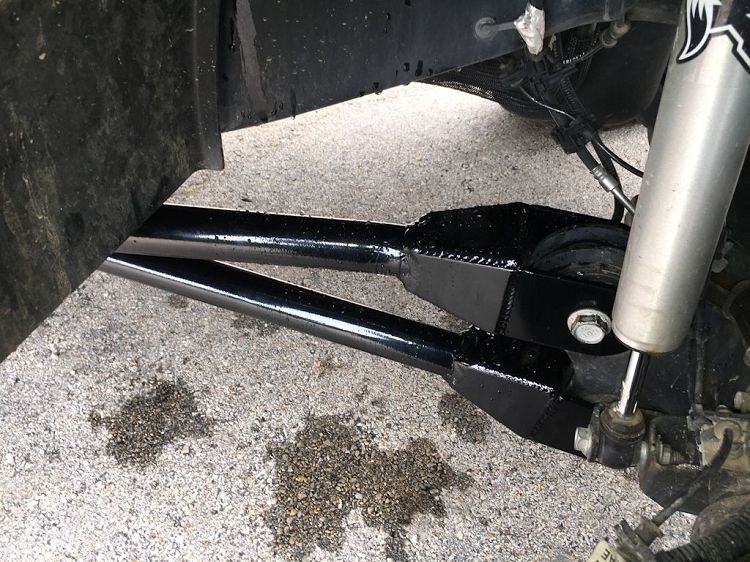 Dodge Off Road 5th gen long arm and frame bracket installed under a Ram heavy-duty truck